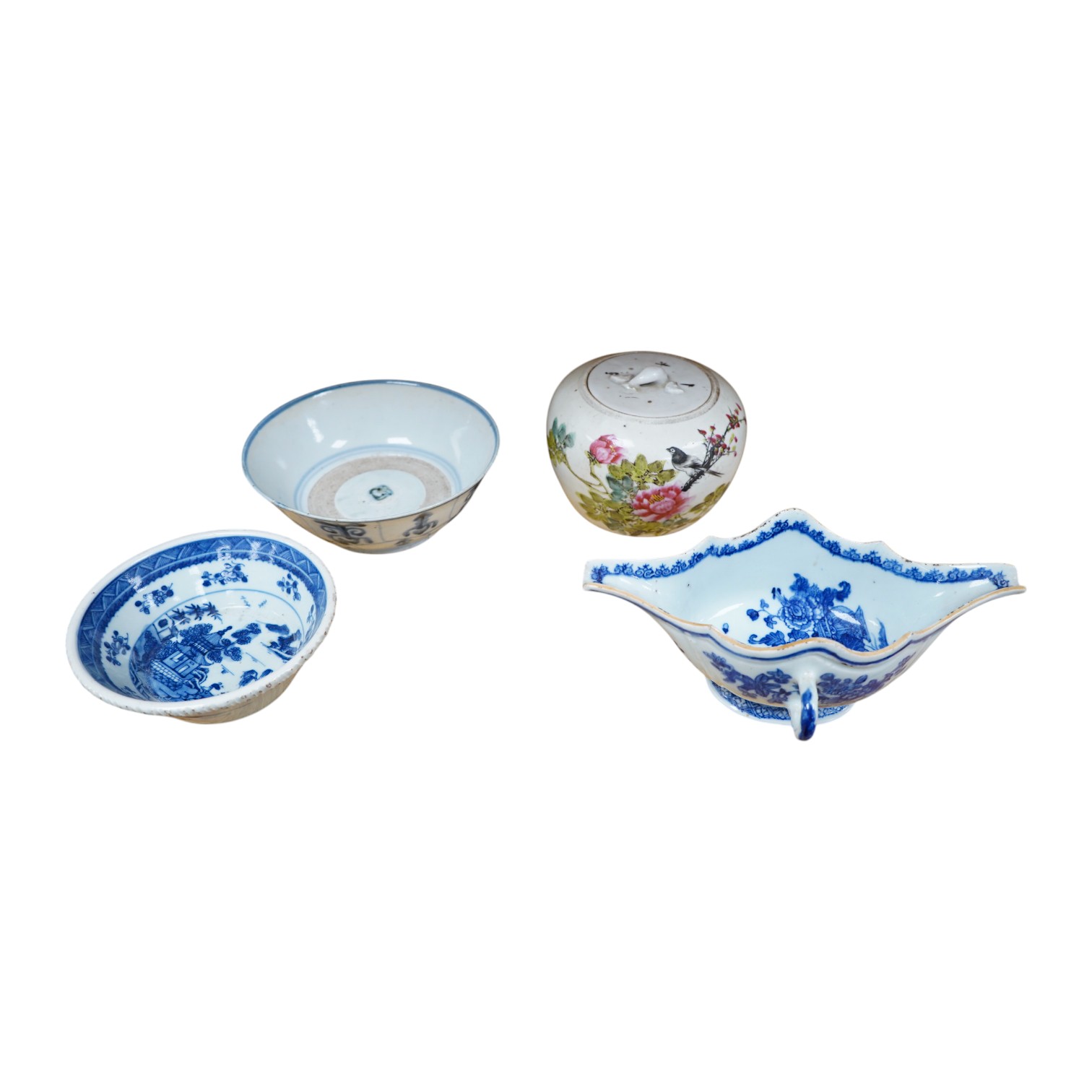 Three pieces of Chinese blue and white porcelain, including a double lipped sauceboat, 8.5cm high, and a famille rose lidded pot. Condition - fair